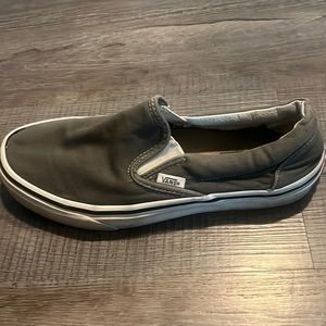 Slip on Vans, used with slight rubber discoloration.